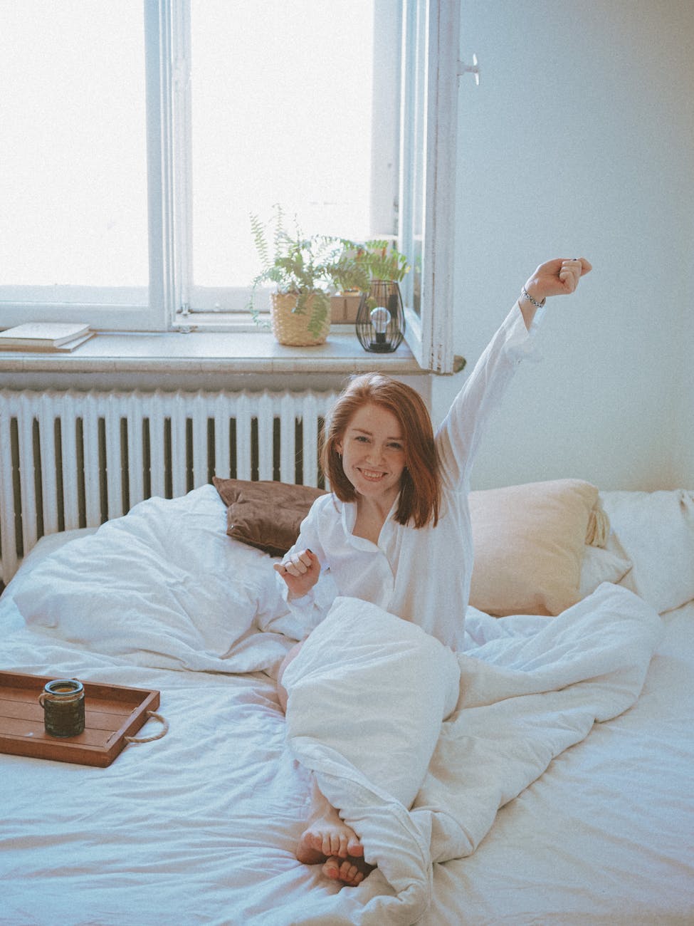 woman enjoying a relaxing morning in bed